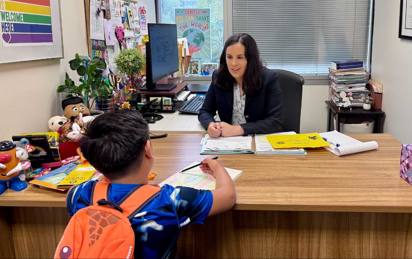 Alexa Sendukas, managing attorney at GHIRP, preparing a 7-year-old client for his asylum interview.