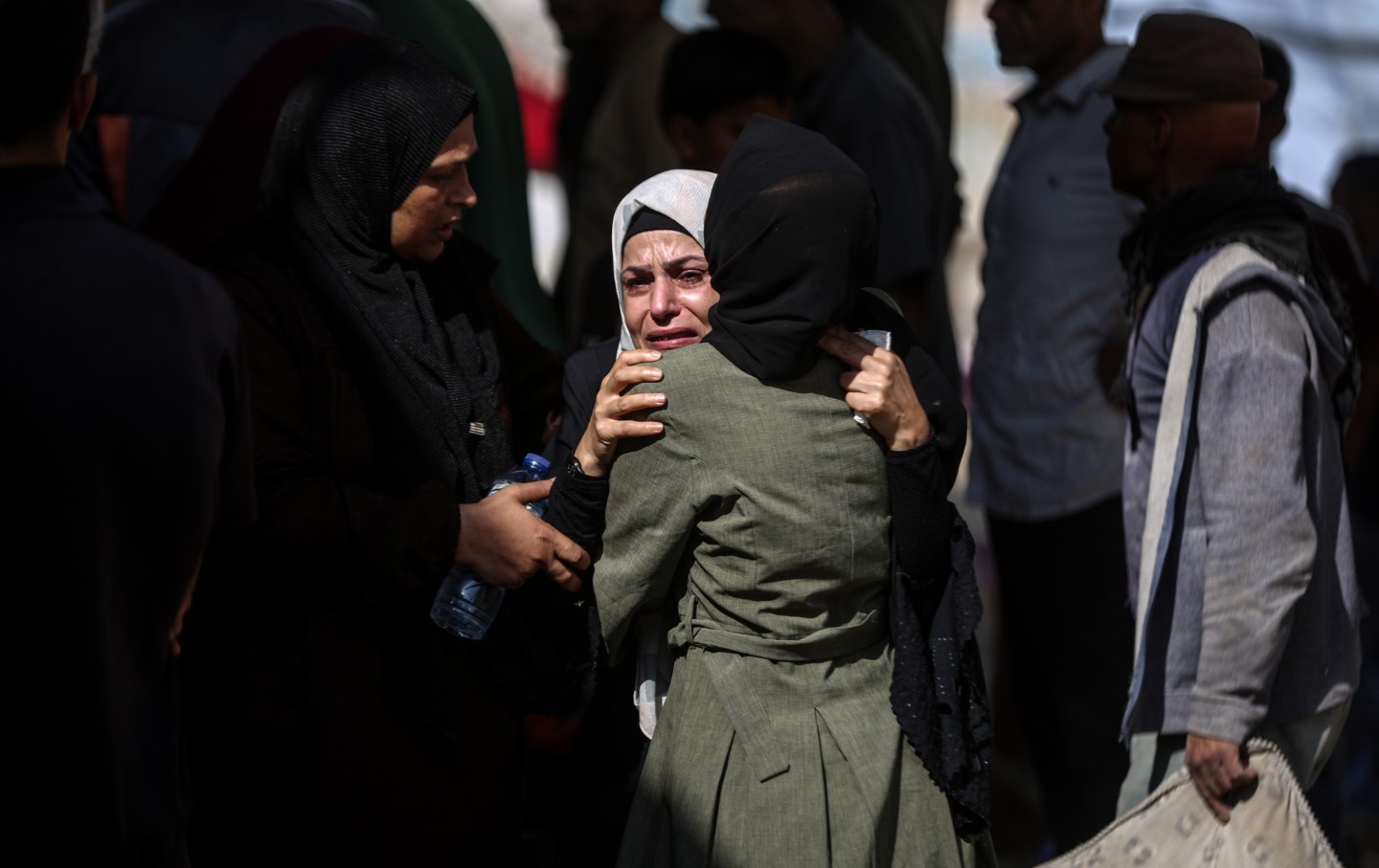Relatives and loved ones of Palestinians, who lost their lives in Israeli attacks while they were in the Netzarim area, where US humanitarian aid points were located, mourn as they attend their funeral ceremony at Shifa Hospital in Gaza on June 10, 2025.