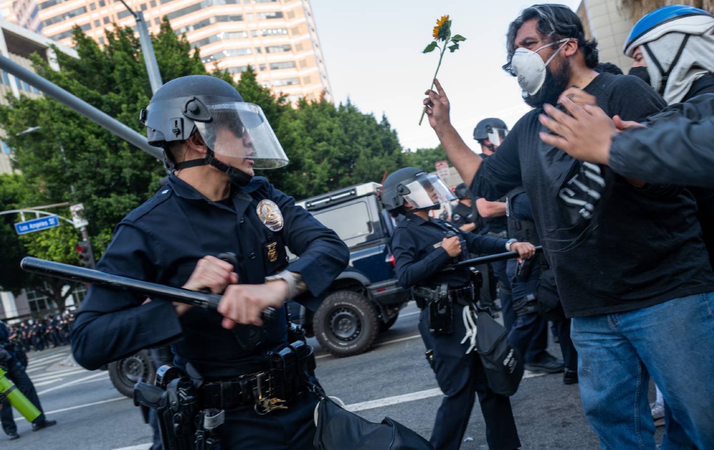 LAPD officers confront protesters after a series of immigration raids in Los Angeles, California.